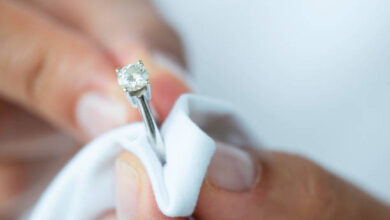 Jeweler is polishing a diamond ring.